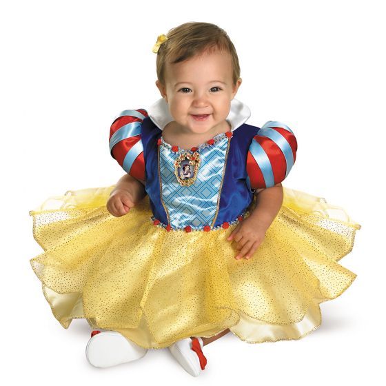 A baby dressed in a snow white costume