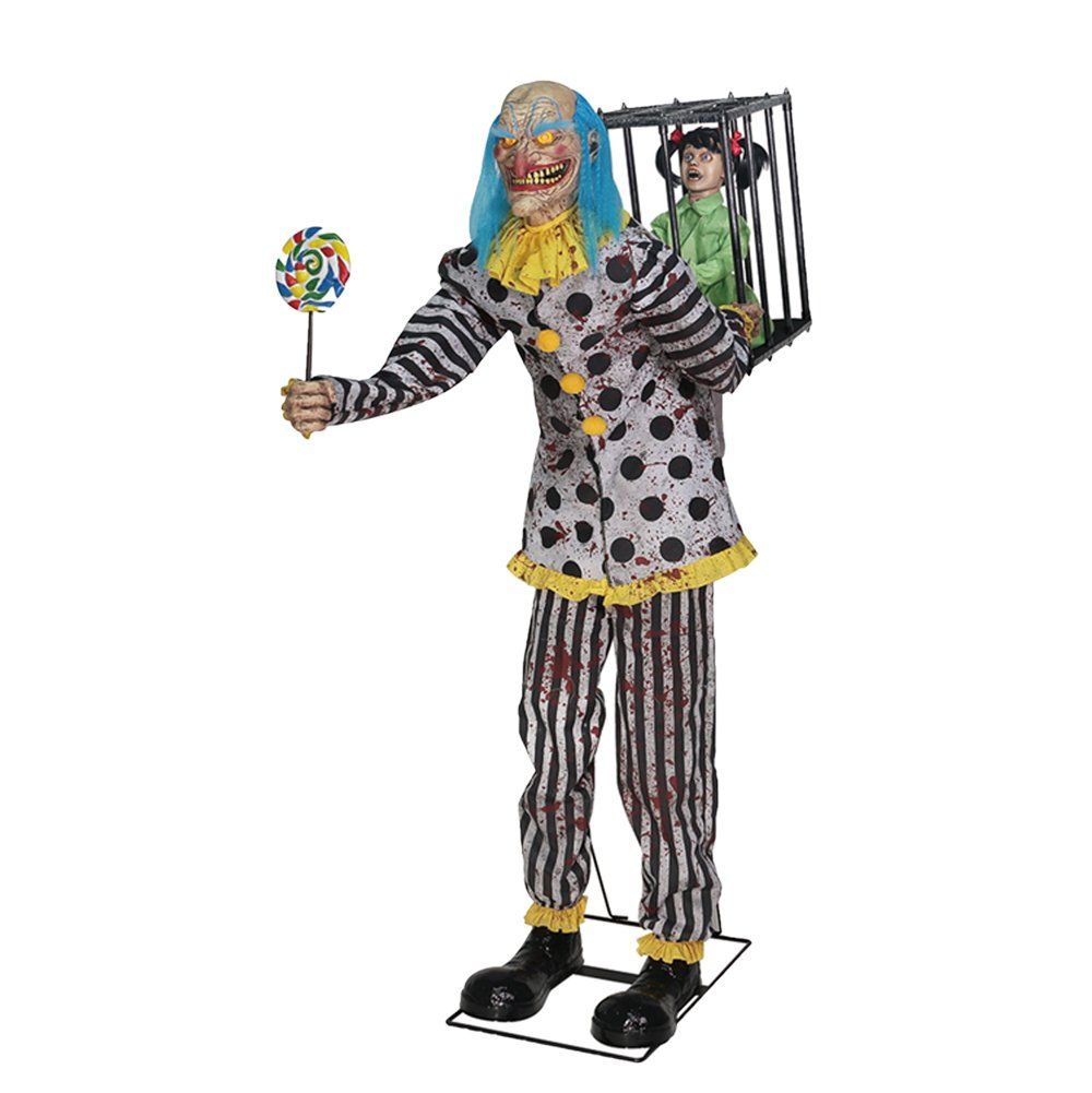 A clown is holding a lollipop and a doll in a cage.
