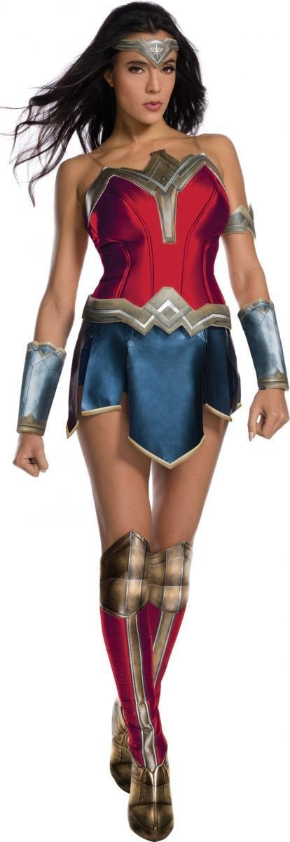 A woman in a wonder woman costume is walking on a white background.