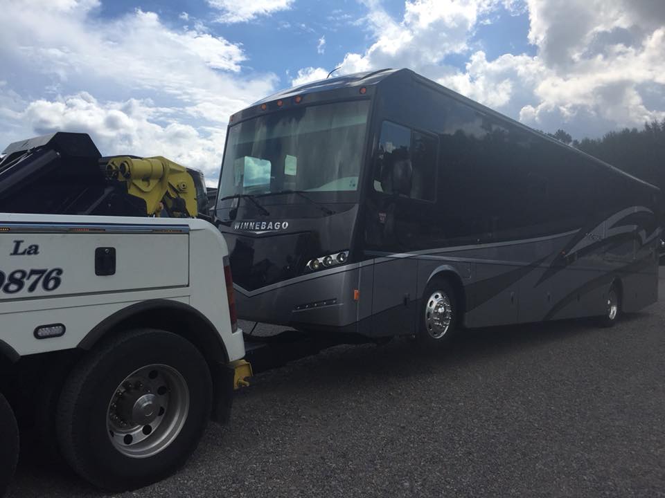 Heavy Duty Towing — Bus Being Towed in  Mandeville, LA