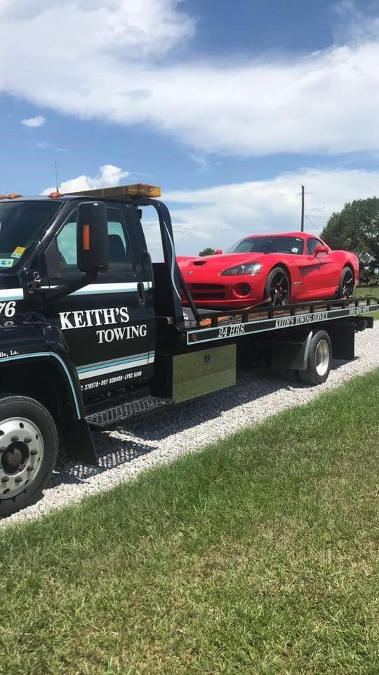 Towing Service — Red Car Towed by Keith's Towing Truck in Mandeville, LA
