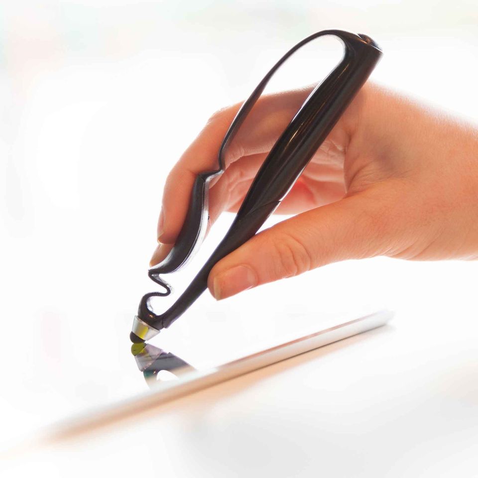 A picture of someone drawing on a touchscreen device with a Scriba Stylus