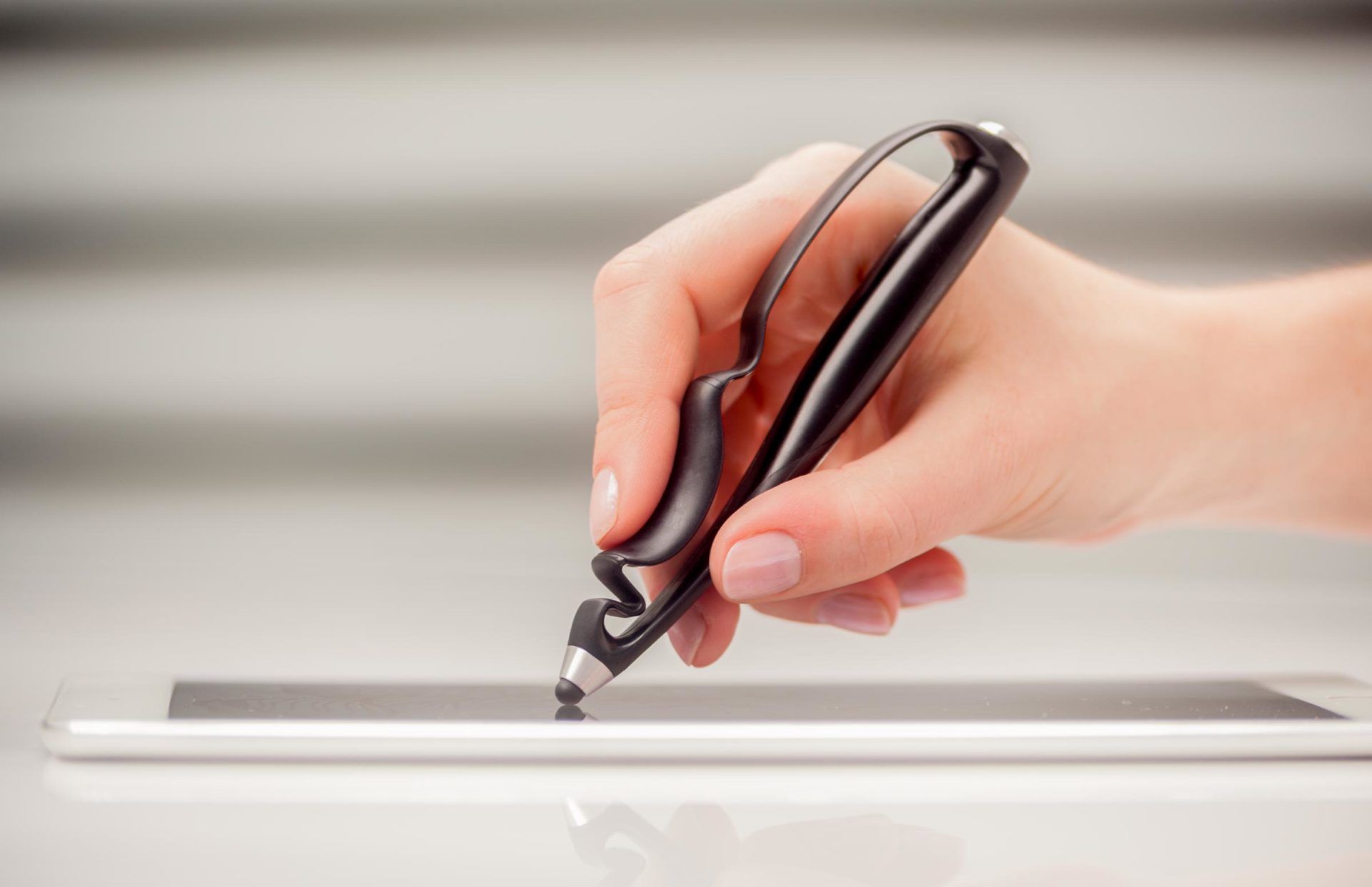 An artist using Scriba stylus in a modern setting