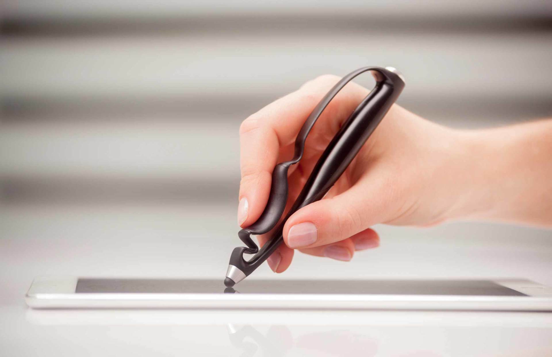 An artist using Scriba stylus in a modern setting
