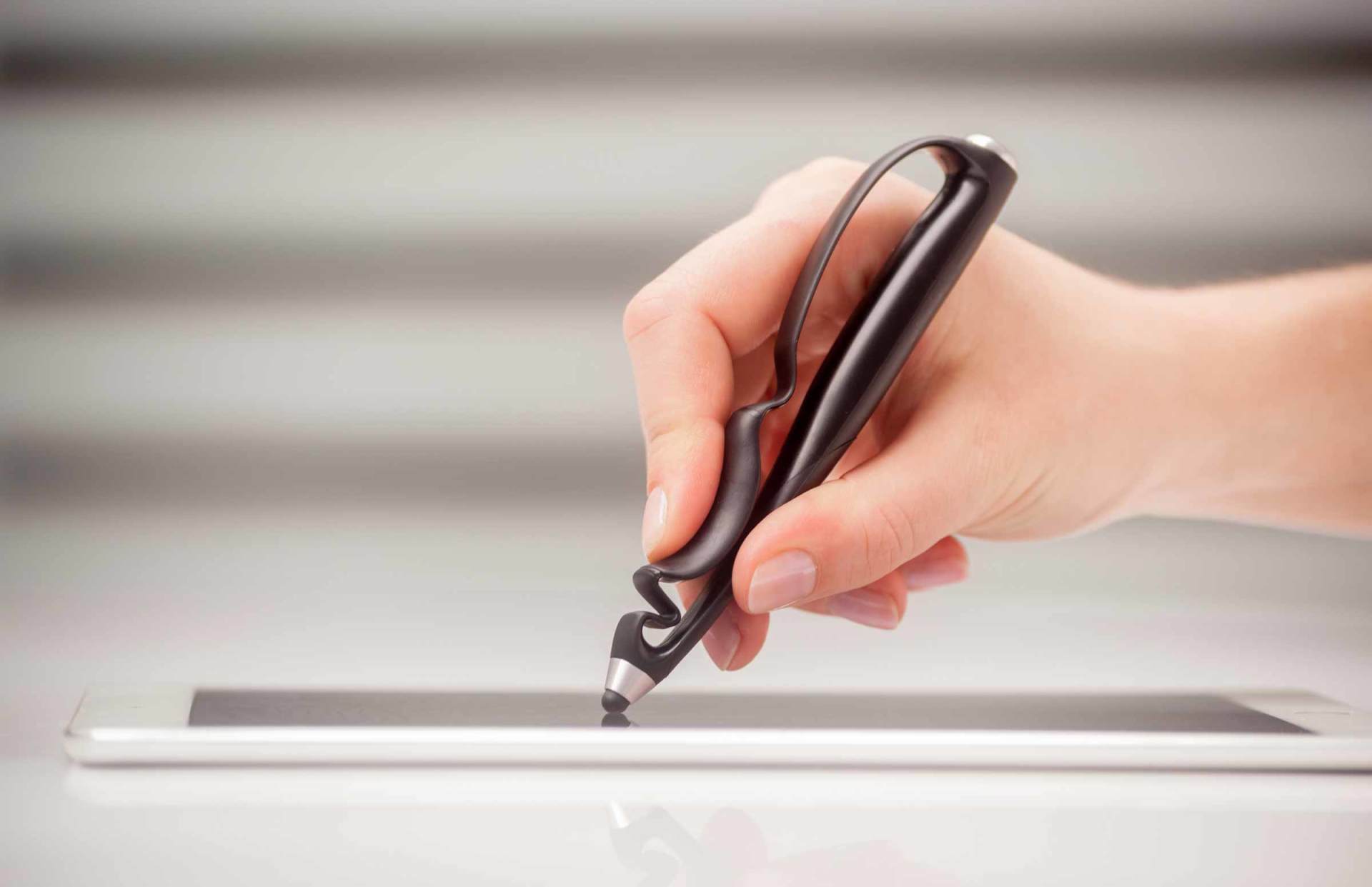 An artist using Scriba stylus in a modern setting