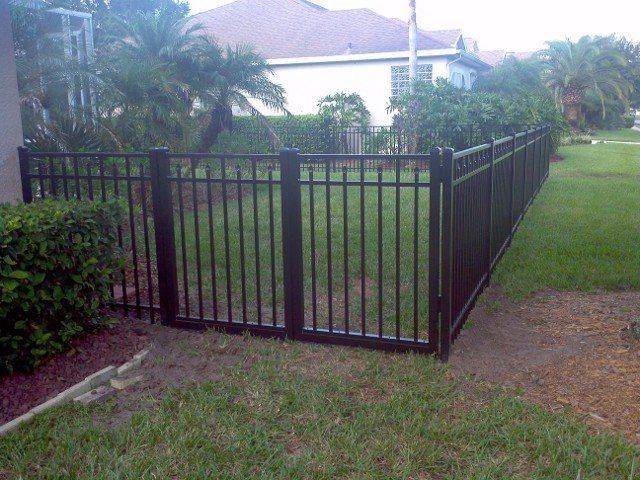 black fence in yard  Fencing Services in New Port Richey, Florida