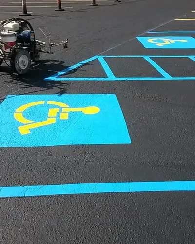 Disability Sign On The Road — Gaston, SC — Huggins Paving & Sealcoating - ABC Sealcoating & Striping