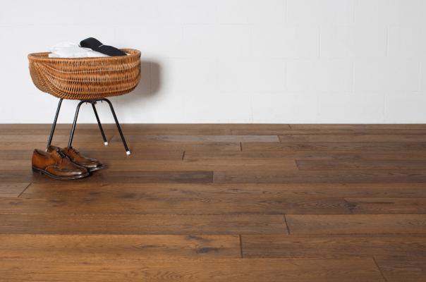 Tile And Stone Flooring — A Piece Chair Under The Wooden Floor in Naples, FL