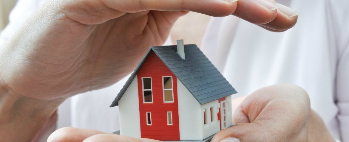 protecting the house with hands