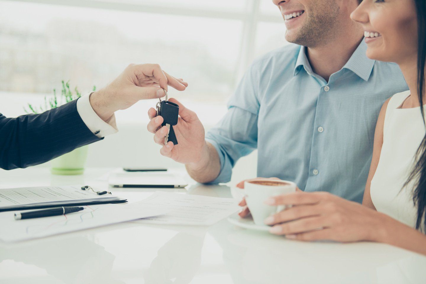 Home loan consultant handing the keys to customer