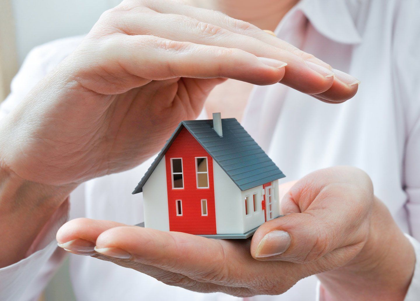 Holding house between hand