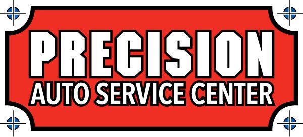 A red sign that says precision auto service center