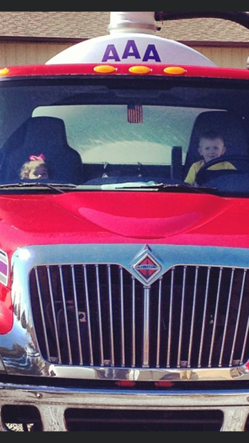 Red Truck with Kids Inside — Hendersonville, NC — AAA Septic Service Inc. Red Truck with Kids Inside — Hendersonville, NC — AAA Septic Service Inc.