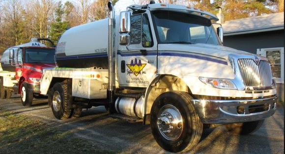 Two Trucks Parking — Hendersonville, NC — AAA Septic Service Inc. Two Trucks Parking — Hendersonville, NC — AAA Septic Service Inc.