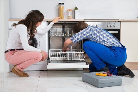 Appliance Repair — Man Repairing Appliances with Woman on His Side in Voorhees, NJ
