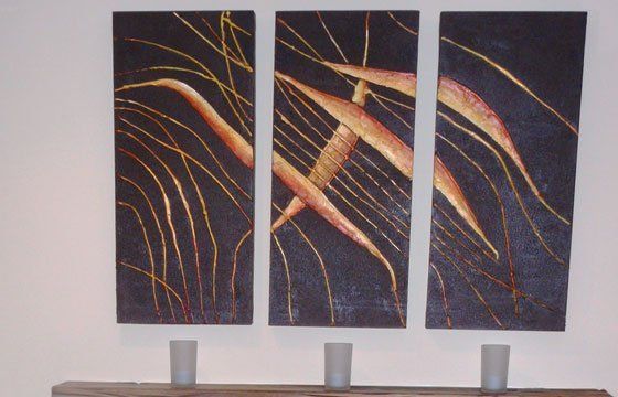 Paintings and prints above fireplace mantel