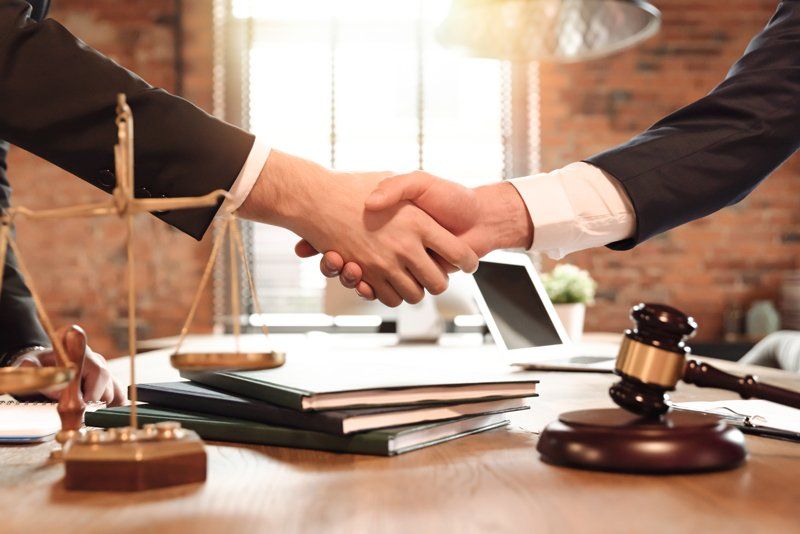 Successful Bail Bond Hand Shake of Two Men — Longview, TX — Second Chance Bail Bonds