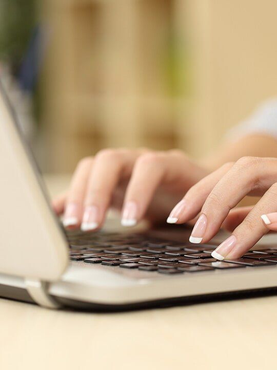 Woman Typing - Carpel Tunnel in Laguna Beach, CA Woman Typing - Carpel Tunnel in Laguna Beach, CA