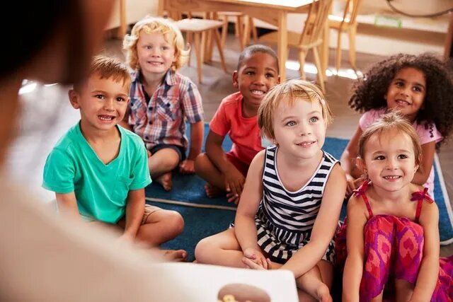 Teacher Reading Story Book to Children — Burtonsville, MD — Childway Early Learning Center