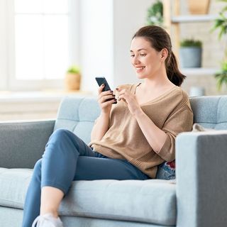 A Woman Using Her Phone — Burtonsville, MD — Childway Early Learning Center