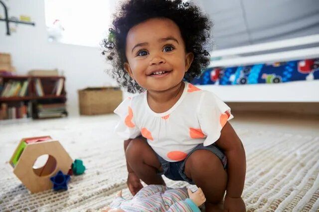 Baby Girl Having Fun In Playroom With Toys — Burtonsville, MD — Childway Early Learning Center
