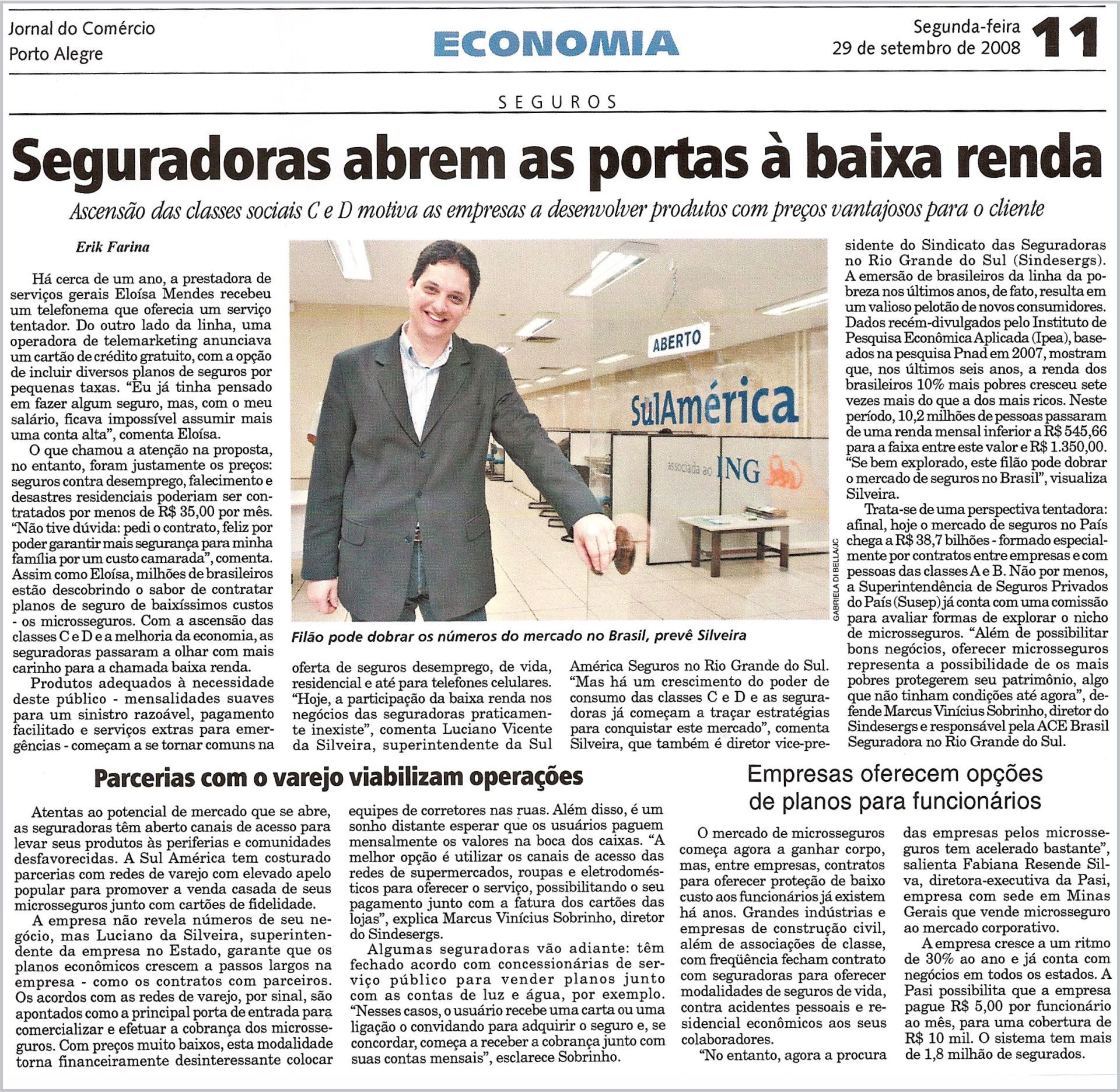 Um homem de terno está na primeira página de um jornal