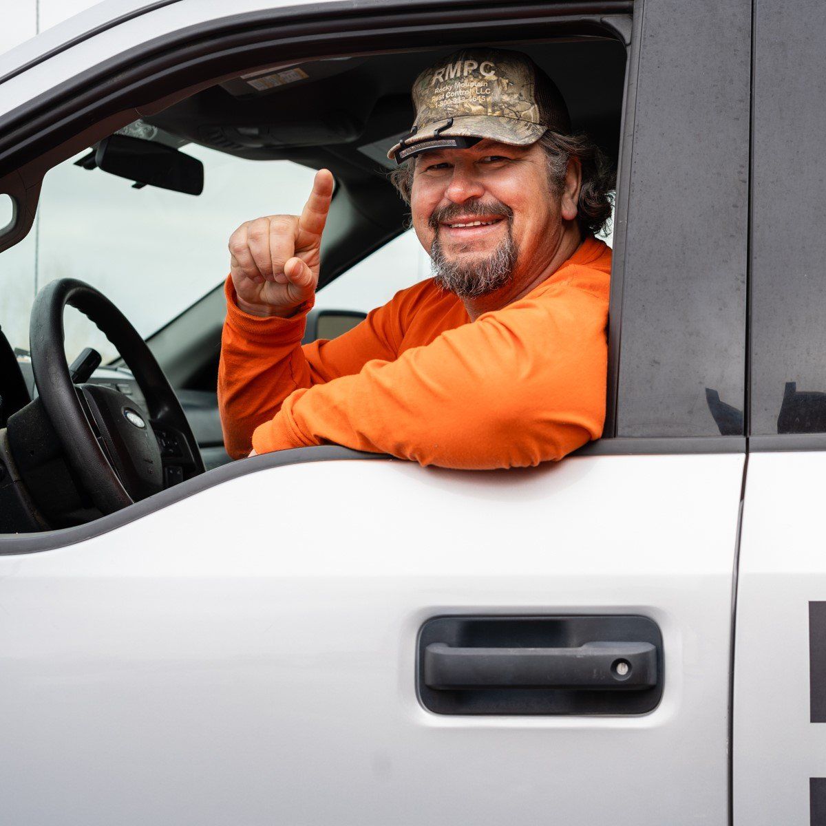 Owner Smiling Inside the Car — Santa Fe, NM — Rocky Mountain Pest Control