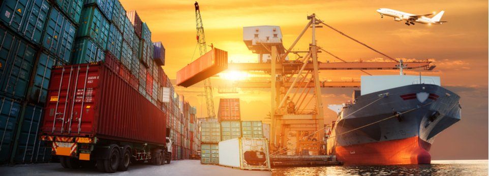 Port Transporters Ships Airplane in the background sunset