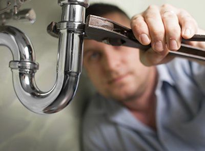 Plumber Repairing Sink — Fort Myers, FL — Panther Plumbing Inc. Plumber Repairing Sink — Fort Myers, FL — Panther Plumbing Inc.