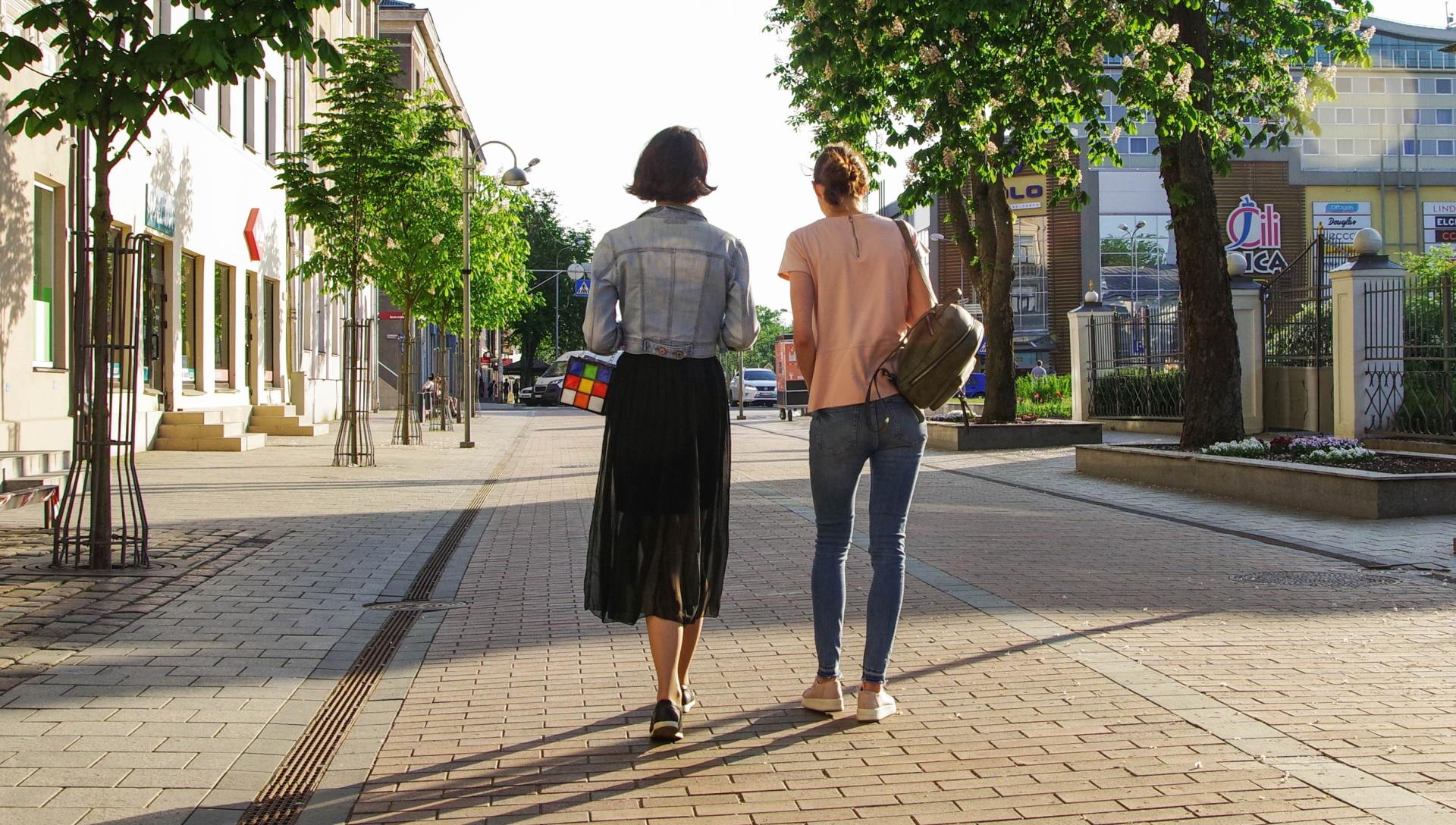 Two ladies walking after plantar wart removal treatment in Buffalo, NY