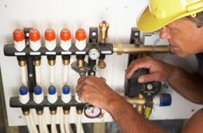 Plumber fixing valves — Plumbing Company in Phoenix, AZ Plumber fixing valves — Plumbing Company in Phoenix, AZ