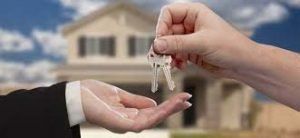 Handing over set of keys to a new home