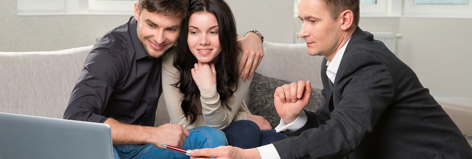a couple looking at house photos
