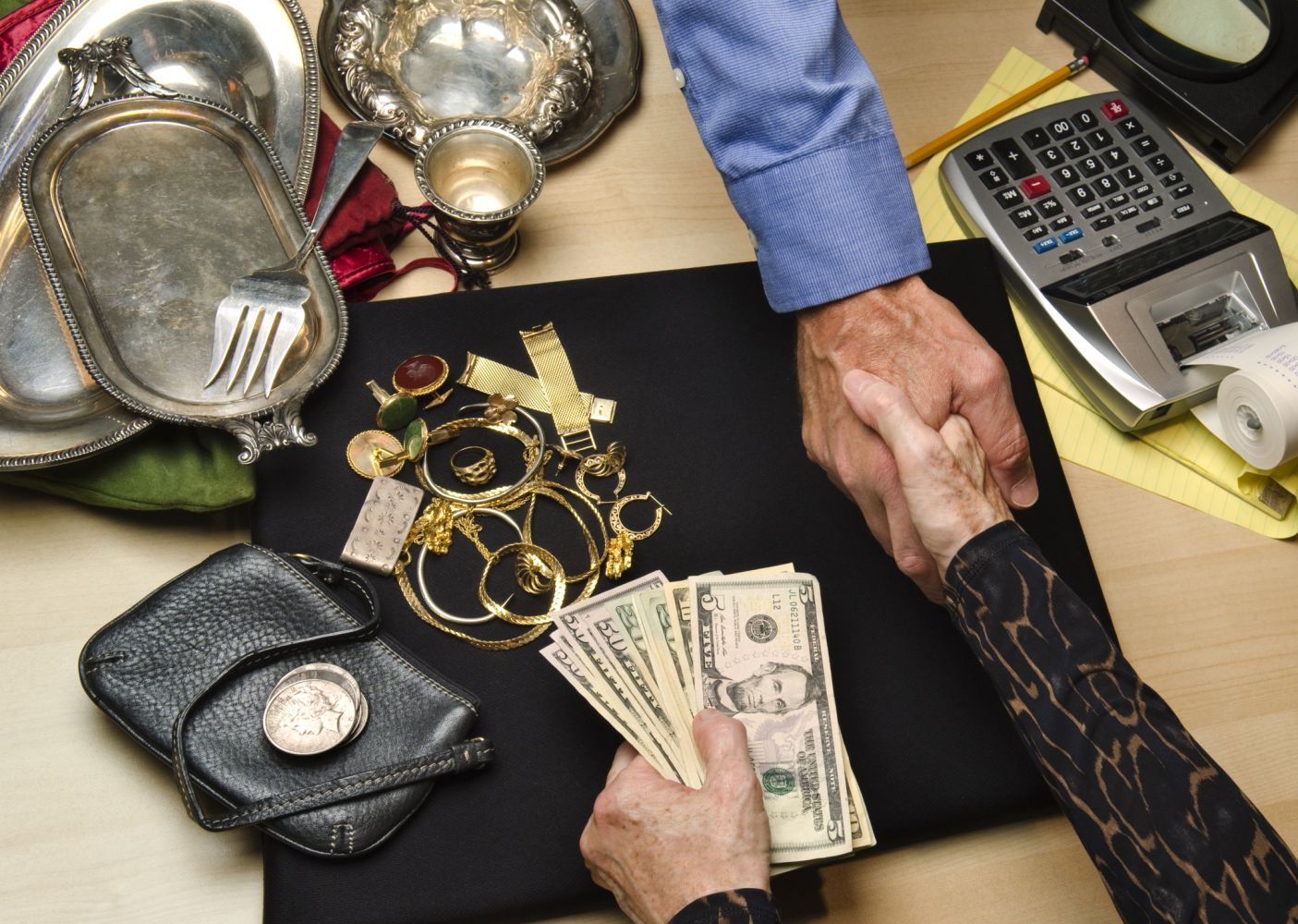 Shaking hands on the deal at pawn shop