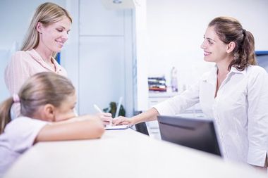 receptionist greeting patients