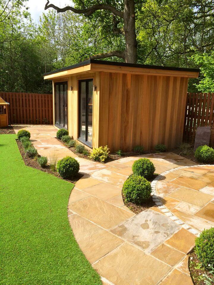 small house in a sunny back yard garden