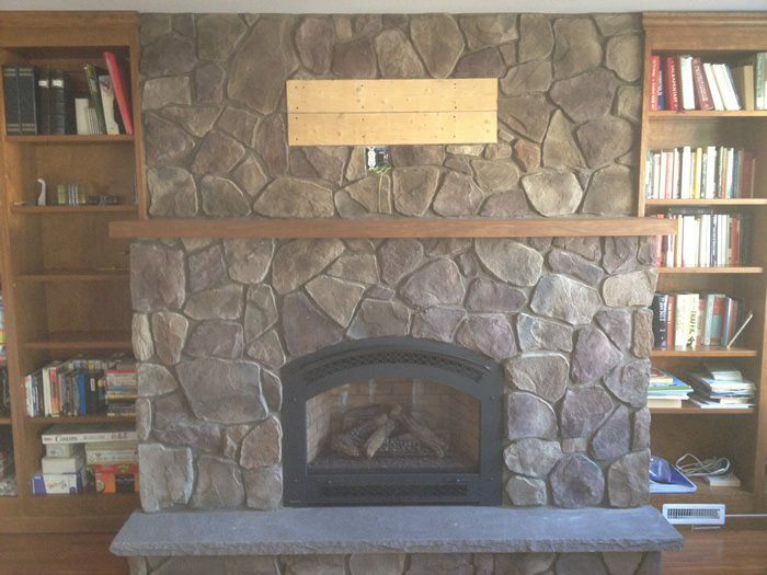 Stone gas fireplace installation