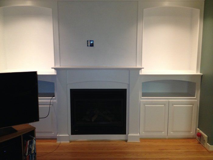 White wood burning fireplace and mantel