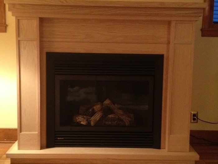 Tan wood exterior and gas fireplace installation