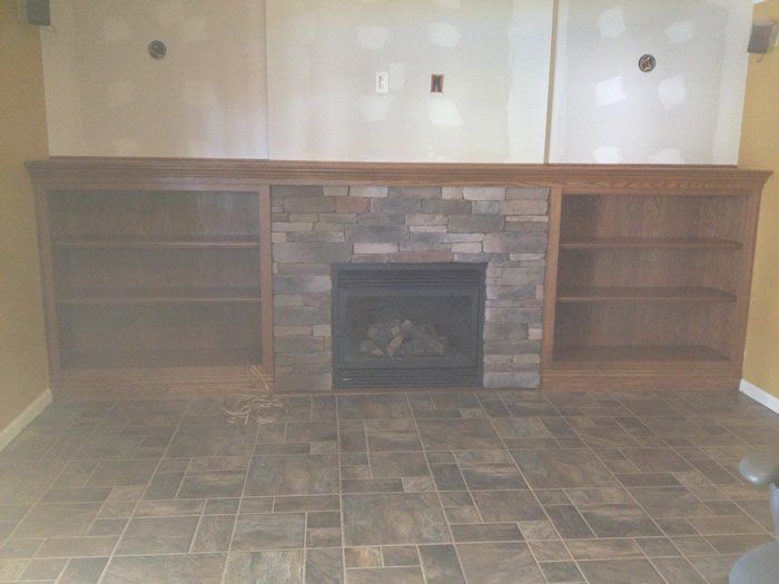 Custom shelves and wood burning fireplace
