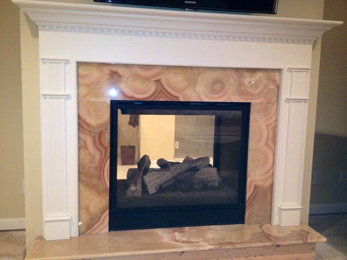 Double sided gas fireplace installation