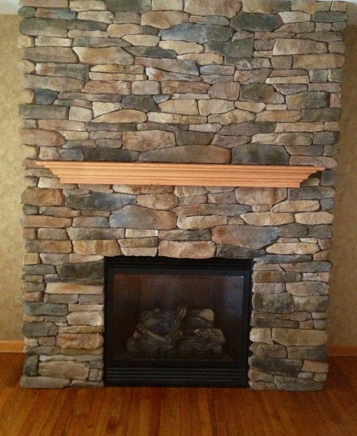 Stone background and gas fireplace installation