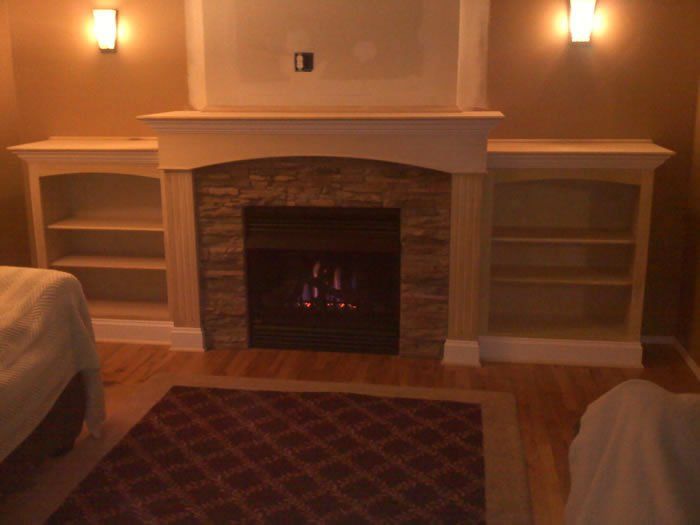 Stone gas fireplace installation