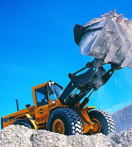 Backhoe lifting rubble - Excavation contractor in Dayton, NJ