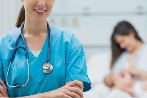 Doctor and Newly Delivered Baby