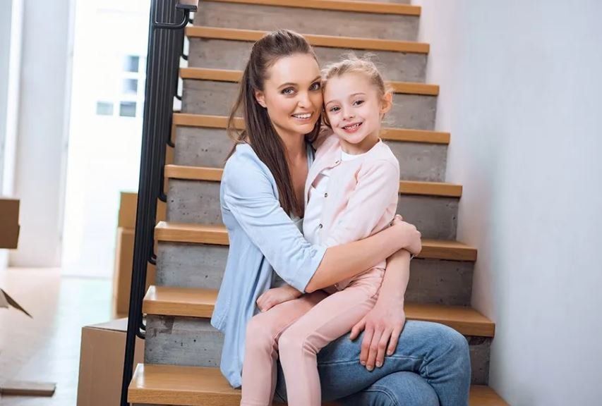 Woman And Happy Kid On Stairs — Demopolis, AL — William C. Poole, LLC