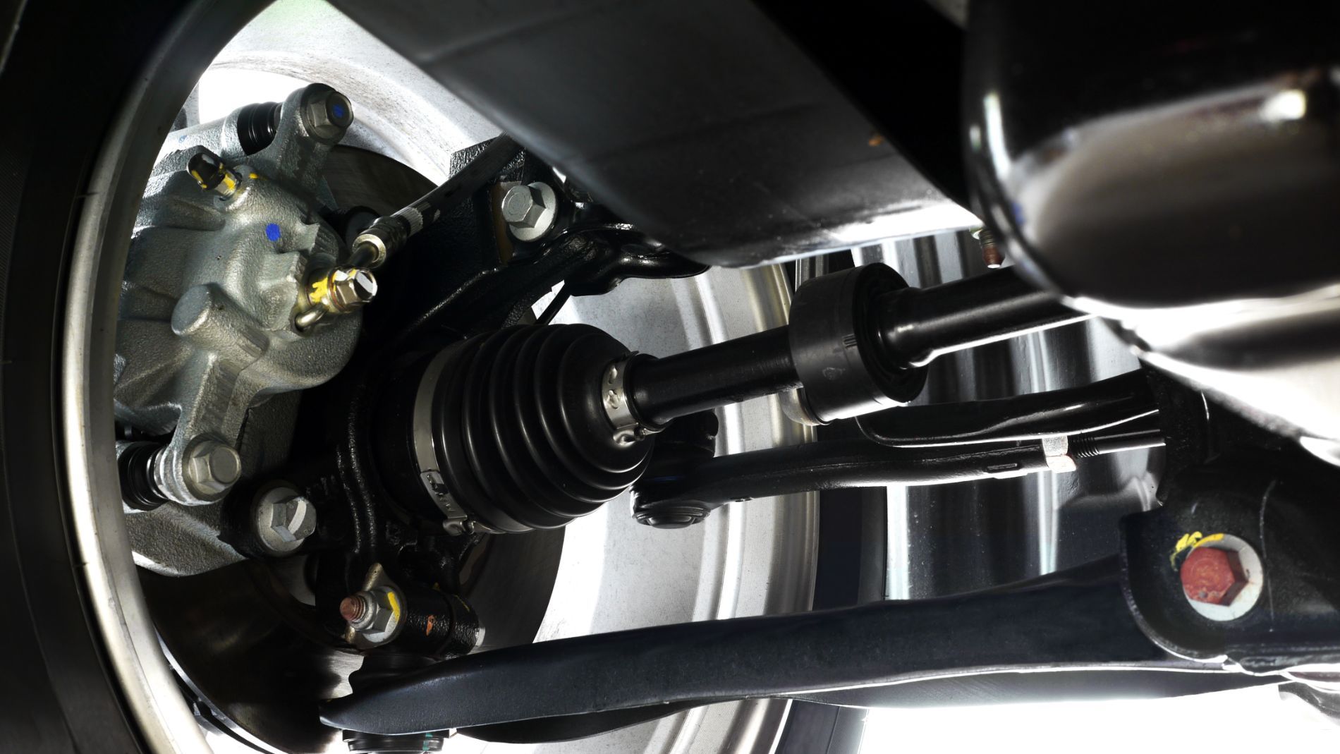 Close-up of a vehicle suspension and CV axle assembly, wheel alignment service in Cincinnati, OH