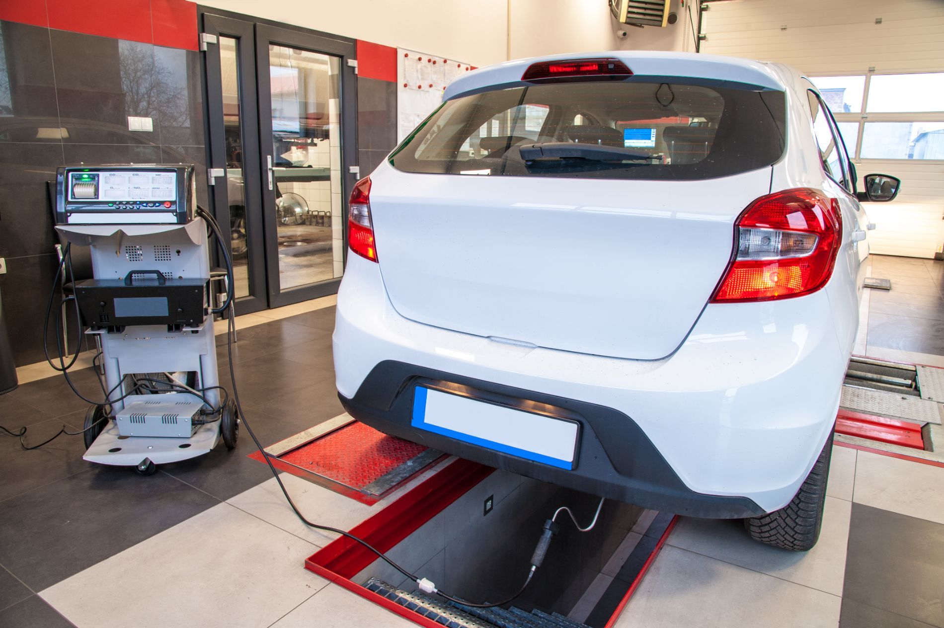 Car on a wheel alignment lift with diagnostic equipment, computerized auto diagnostics in Cincinnati, OH