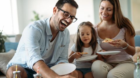 Happy Family Sharing Pizza at Home — Stroudsburg, PA — New Horizons Transportation LLC Happy Family Sharing Pizza at Home — Stroudsburg, PA — New Horizons Transportation LLC