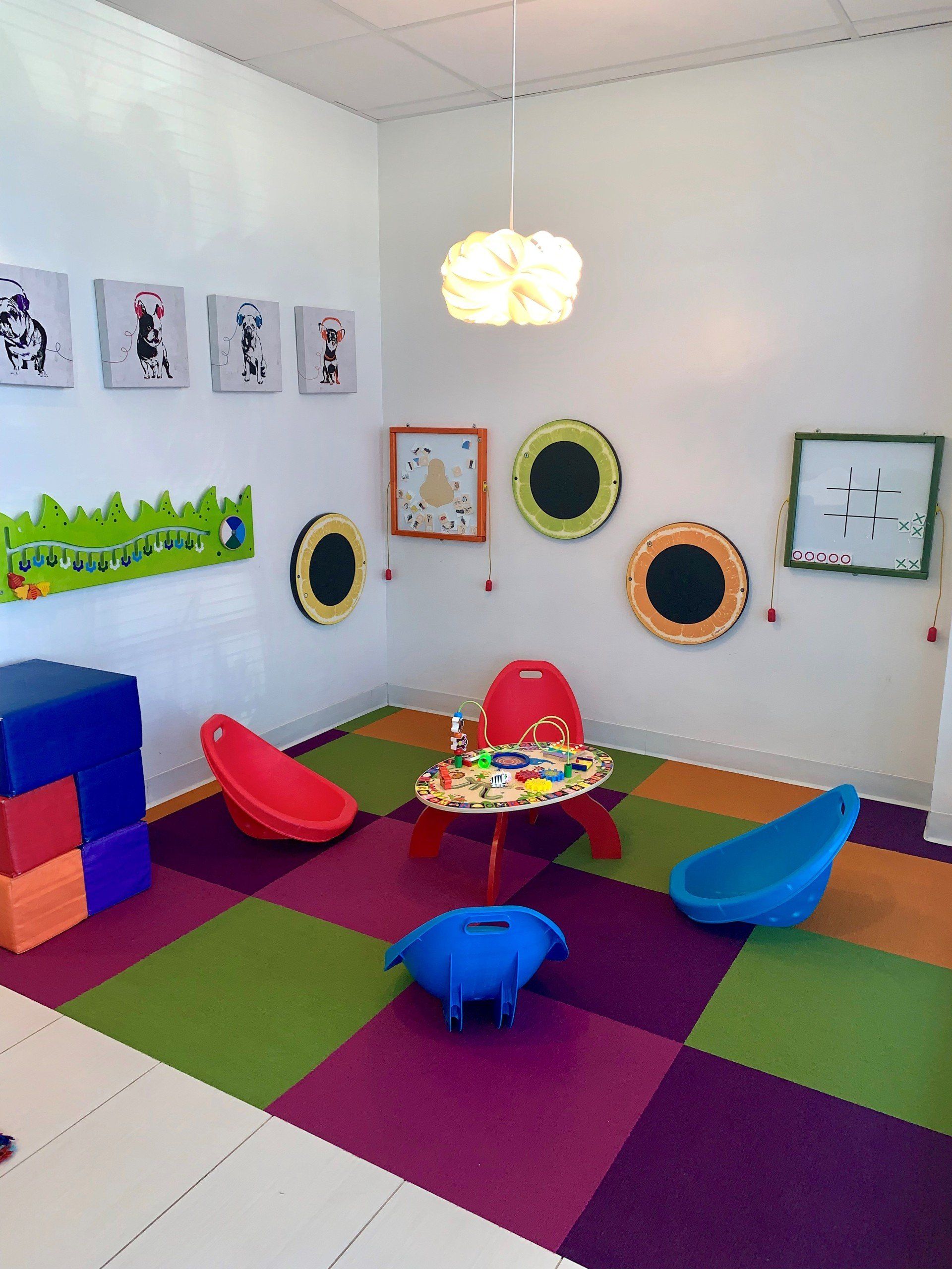 A room with a table and chairs in it